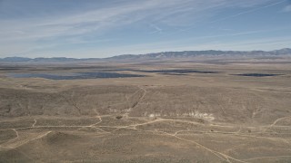 AX0005_072 - 5K aerial stock footage orbit Antelope Valley Desert Solar Array in California