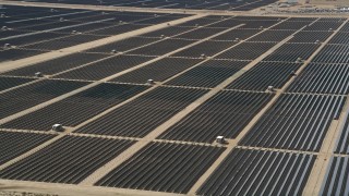 AX0005_078 - 5K aerial stock footage orbit massive solar energy array in the desert of Antelope Valley, California
