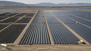 AX0005_081E - 5K stock footage aerial video of desert solar panel array in Antelope Valley, California