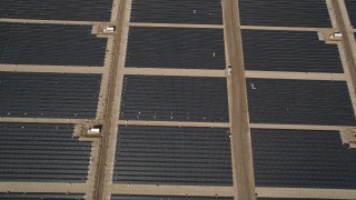 AX0005_104 - 5K stock footage aerial video of a bird's eye view of large solar energy array in the Antelope Valley, California