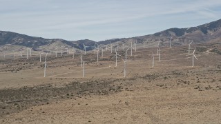 AX0005_144 - 5K aerial stock footage approach wind farm windmills in the desert of Antelope Valley, California