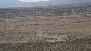 AX0005_145 - 5K stock footage aerial video circle a group of Mojave Desert windmills in Antelope Valley, California