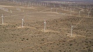 AX0006_044 - 5K aerial stock footage approach three windmills at a wind farm in the California desert