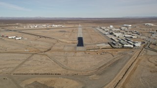 AX0006_054 - 5K stock footage aerial video approach runway at Mojave Air and Space Port in California