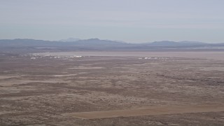 AX0006_108 - 5K stock footage aerial video of Edwards Air Force Base and Rogers Dry Lake in the Mojave Desert, California