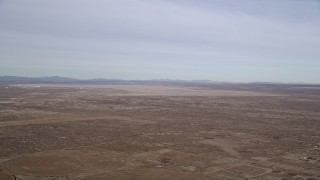 AX0006_109 - 5K stock footage aerial video of Edward Air Force Base and dry lake in the Mojave Desert, California