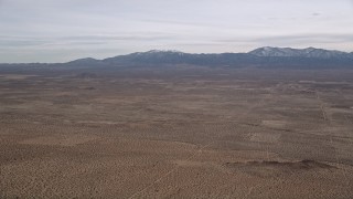 AX0006_119 - 5K aerial stock footage of VFX Plate of desert with mountains background, Mojave Desert, California