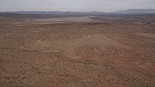 AX0006_123 - 5K aerial stock footage of VFX Background Plate of dry lake in the Mojave Desert, California