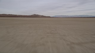 AX0006_138 - 5K aerial stock footage of flying low over El Mirage Lake in the Mojave Desert of California