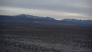 AX0007_030 - 5K aerial stock footage of VFX Plate of Mojave Desert and mountains with snow at twilight, California