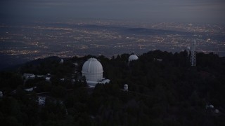 AX0008_055 - 5K aerial stock footage orbiting around the Mount Wilson Observatory at twilight, California
