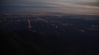 AX0008_062 - 5K aerial stock footage of lights of suburban San Gabriel Valley at twilight in California