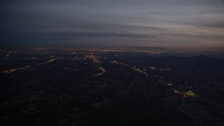 AX0008_064 - 5K aerial stock footage of lights of San Gabriel Valley at twilight, California