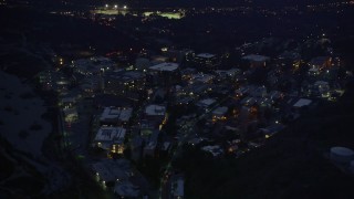 AX0008_066 - 5K aerial stock footage of approaching Jet Propulsion Laboratory at night in Pasadena, California