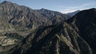AX0009_009E - 5K aerial stock footage approach and fly over green ridges in the San Gabriel Mountains, California