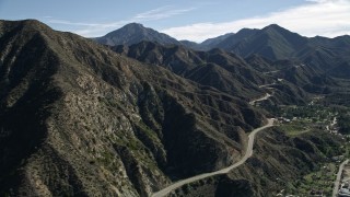 AX0009_013E - 5K aerial stock footage of Big Tujunga Canyon Road in the San Gabriel Mountains, California