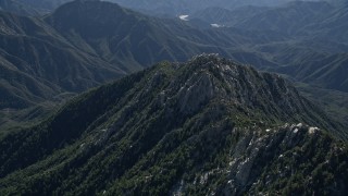AX0009_035 - 5K aerial stock footage of rugged green peak in the San Gabriel Mountains, California