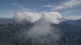 AX0009_081 - 5K aerial stock footage of a cloud over the San Bernardino Mountains in California