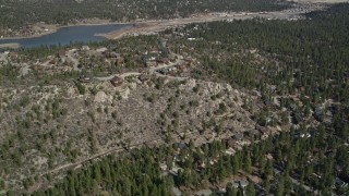 AX0009_141 - 5K aerial stock footage of hilltop homes at small town of Big Bear Lake, California
