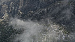 AX0010_114 - 5K aerial stock footage of bird's eye view of a gondola heading up the San Jacinto Mountains, California