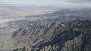 AX0010_123 - 5K aerial stock footage of North Palm Springs seen from the San Jacinto Mountains, California