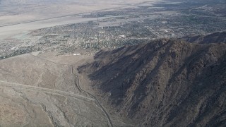 AX0010_126 - 5K aerial stock footage tilt from Tram Way to reveal North Palm Springs, California