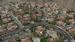AX0010_133 - 5K aerial stock footage orbiting a suburban neighborhood in West Palm Springs, California