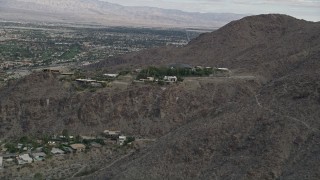 AX0010_135 - 5K aerial stock footage approach hilltop mansions in West Palm Springs, California