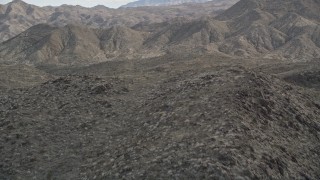 AX0010_138 - 5K aerial stock footage approach and fly over arid ridge in the San Jacinto Mountains, California