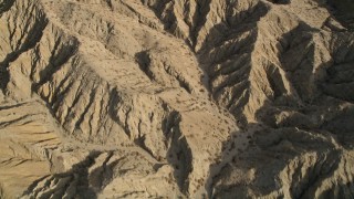 AX0011_003 - 5K stock footage aerial video bird's eye view of an arid mountain range in the Mojave Desert, California