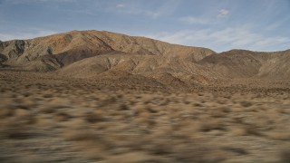 AX0011_013 - 5K aerial stock footage low altitude flyby of desert mountains in Joshua Tree National Park, California