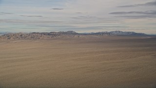 AX0011_068 - 5K stock footage aerial video of a view across the Mojave Desert to mountains in California 