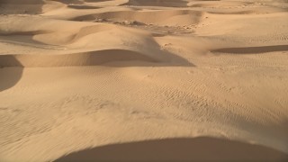 AX0012_015 - 5K aerial stock footage fly over sand dunes, Kelso Dunes, Mojave Desert, California