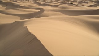 AX0012_027E - 5K aerial stock footage fly low over sand dunes, Kelso Dunes, Mojave Desert, California