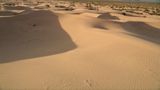 AX0012_036 - 5K aerial stock footage pan across sand dunes, Kelso Dunes, Mojave Desert, California
