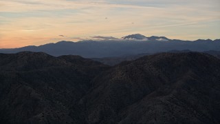 AX0012_065 - 5K aerial stock footage fly over desert mountains, Mojave Desert, California