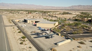 AX0013_001 - 5K aerial stock footage fly by planes at the air museum, Palm Springs, California