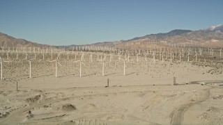 AX0013_004 - 5K aerial stock footage of a wind farm in the desert, San Gorgonio Pass Wind Farm, California
