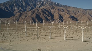 AX0013_005 - 5K aerial stock footage of wind farm in the desert, San Gorgonio Pass Wind Farm, California