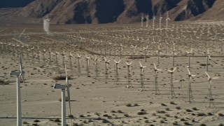 AX0013_008 - 5K aerial stock footage of desert wind farm, San Gorgonio Pass Wind Farm, California