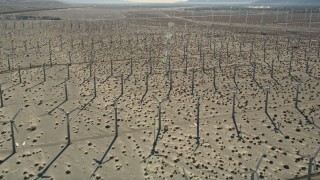 AX0013_028E - 5K aerial stock footage fly over windmill farm in the desert, San Gorgonio Pass Wind Farm, California