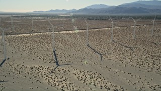 AX0013_030 - 5K aerial stock footage approach and fly over windmills, San Gorgonio Pass Wind Farm, California