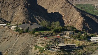 AX0013_044E - 5K aerial stock footage of a mansion in the hills, West Palm Springs, California
