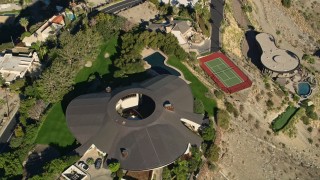 AX0013_046 - 5K aerial stock footage of a bird's eye of a mansion in the hills, West Palm Springs, California