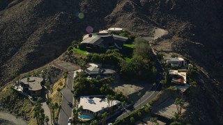 AX0013_049E - 5K aerial stock footage fly over mansions on the hill top, West Palm Springs, California