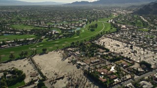 AX0013_061 - 5K aerial stock footage video fly over residential neighborhoods toward golf course, Rancho Mirage, California