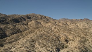 AX0014_001 - 5K aerial stock footage of flying up hills toward San Jacinto Mountains, California