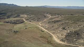 AX0014_017 - 5K aerial stock footage approach rural homes in Mountain Center, California