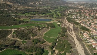 AX0014_050 - 5K aerial stock footage of flying over a golf course, Temecula, California