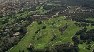 AX0015_002 - 5K aerial stock footage video fly by greens at a golf course, Temecula, California